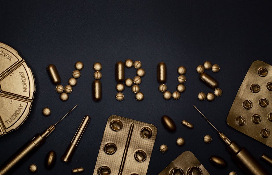 Conceptual image featuring gold pills and syringes forming the word 'virus' on a dark backdrop.