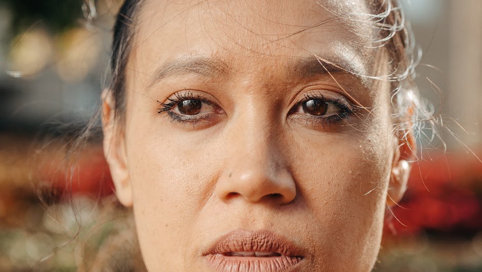 Detailed close-up of a woman's face capturing her expressive eyes.