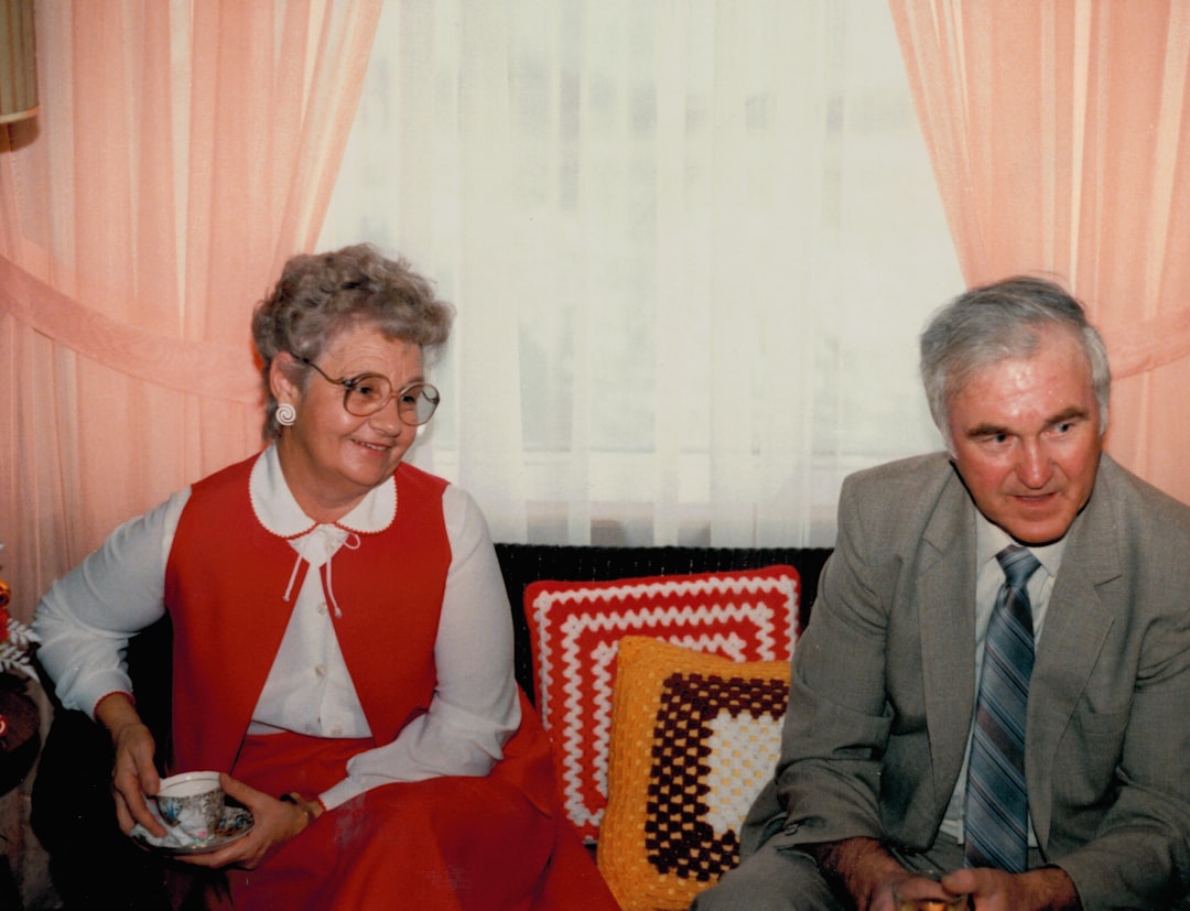 middle-aged couple looking frustrated in bedroom