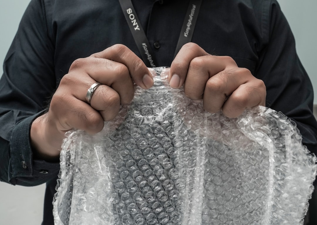 person holding silver mesh net